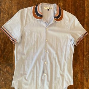 Hand embroidered light blue top by Dutch designer